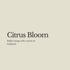 A flat warm beige background with centered text reading 'Citrus Bloom' and smaller text below saying 'Bright orange with a touch of bergamot.'.