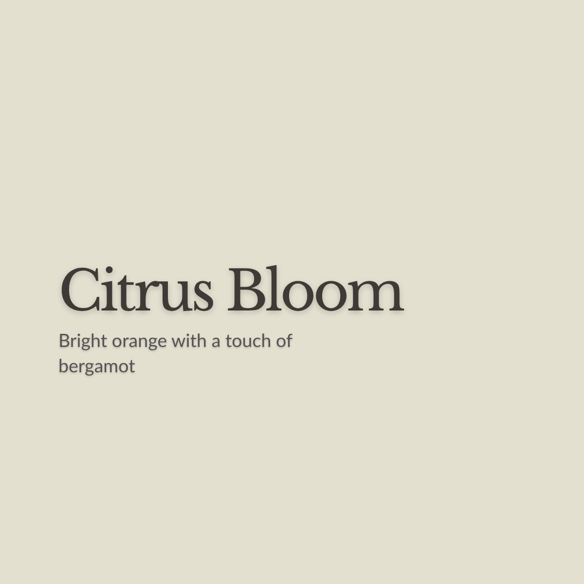 A flat warm beige background with centered text reading 'Citrus Bloom' and smaller text below saying 'Bright orange with a touch of bergamot.'.