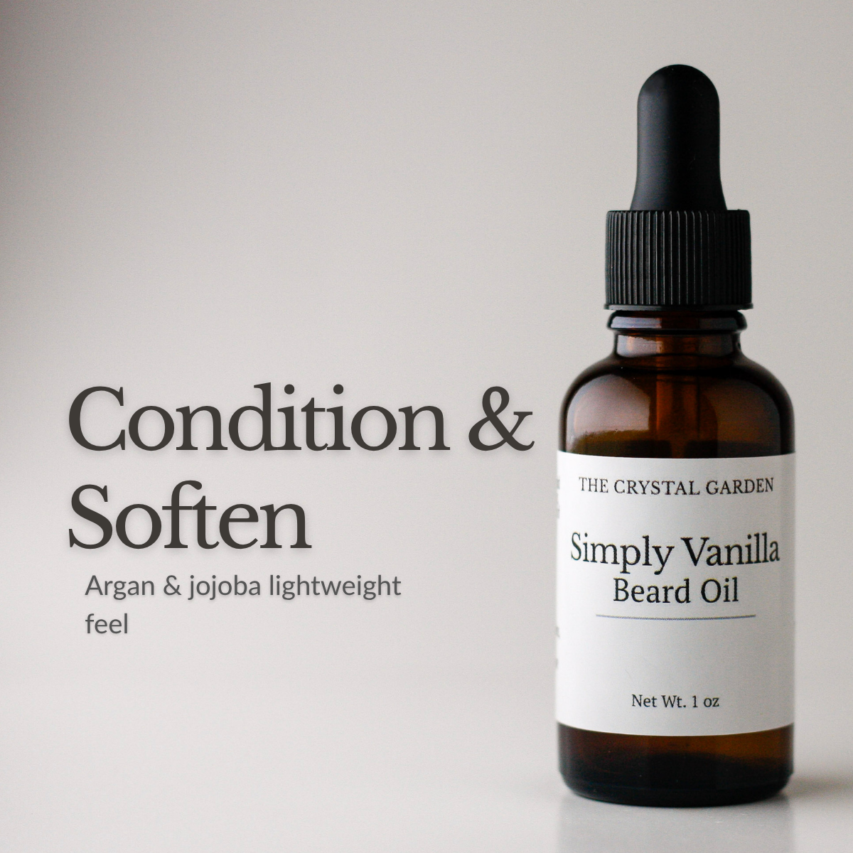 Amber glass dropper bottle of The Crystal Garden Simply Vanilla Beard Oil with a black dropper cap and white label, shown next to text reading 'Condition & Soften' and 'Argan & jojoba lightweight feel' on a light gray background.