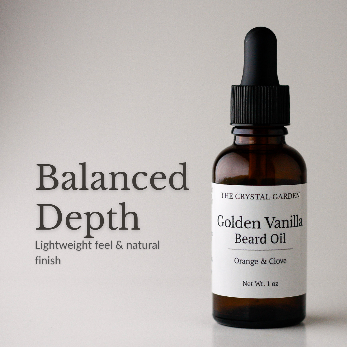 Amber glass dropper bottle of The Crystal Garden Golden Vanilla Beard Oil with a black dropper cap and white label, shown beside the text 'Balanced Depth' on a light gray background.