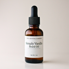 A 1 oz amber glass dropper bottle of The Crystal Garden Simply Vanilla Beard Oil with a black dropper cap and white label, set against a plain light beige background.
