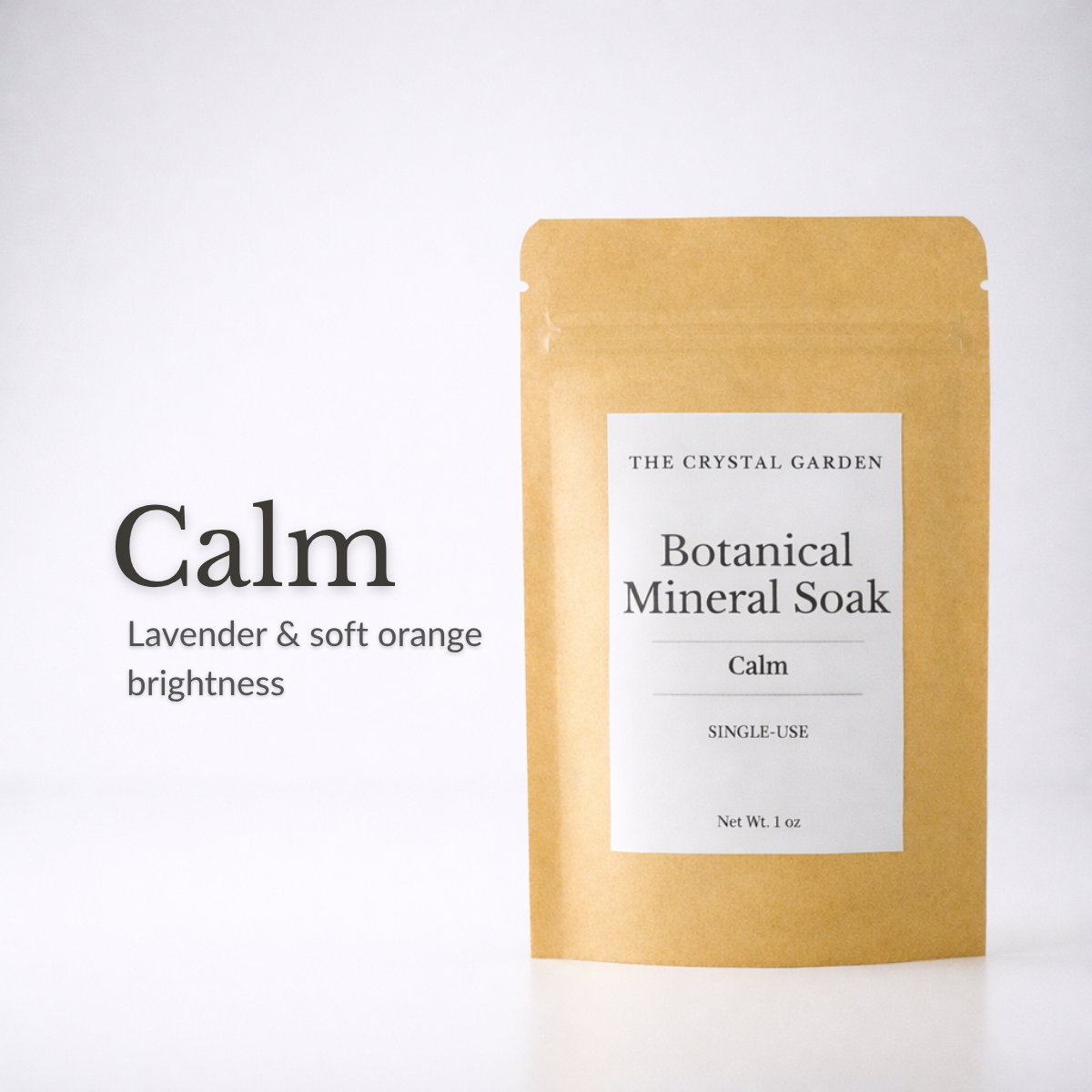 A kraft paper stand-up pouch labeled 'THE CRYSTAL GARDEN Botanical Mineral Soak Calm' on a white background, with text on the left reading 'Calm Lavender & soft orange brightness.'.