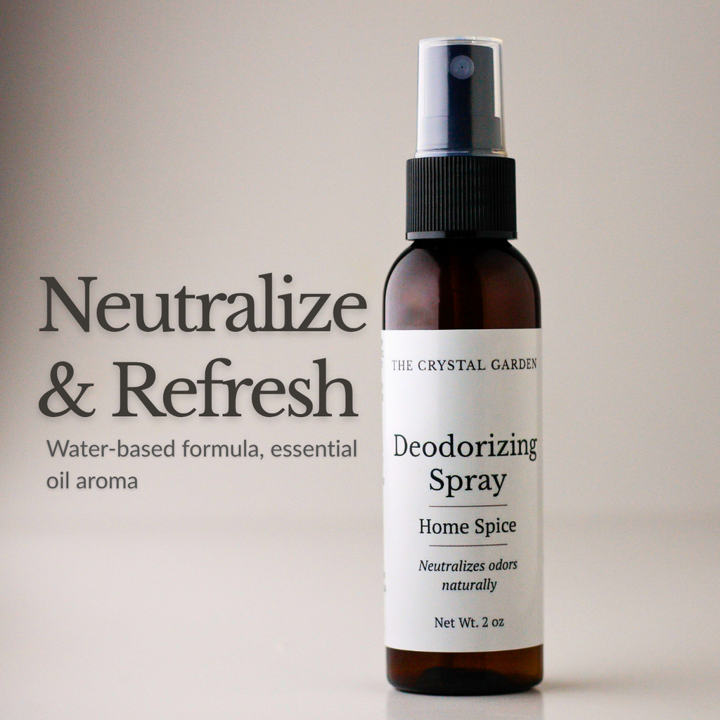 A 2 oz amber glass spray bottle of The Crystal Garden Deodorizing Spray with a black spray cap and white label, shown next to text that reads 'Neutralize & Refresh' on a warm beige background.