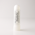 A white cylindrical tube of 'Headache' aromatherapy inhaler by The Crystal Garden, standing upright on a clean white background.