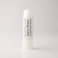 A white plastic aromatherapy inhaler tube standing upright on a light gray background. The label reads 'THE CRYSTAL GARDEN' and 'Inner Peace Aromatherapy Inhaler'.