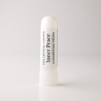 A white plastic aromatherapy inhaler tube standing upright on a light gray background. The label reads 'THE CRYSTAL GARDEN' and 'Inner Peace Aromatherapy Inhaler'.