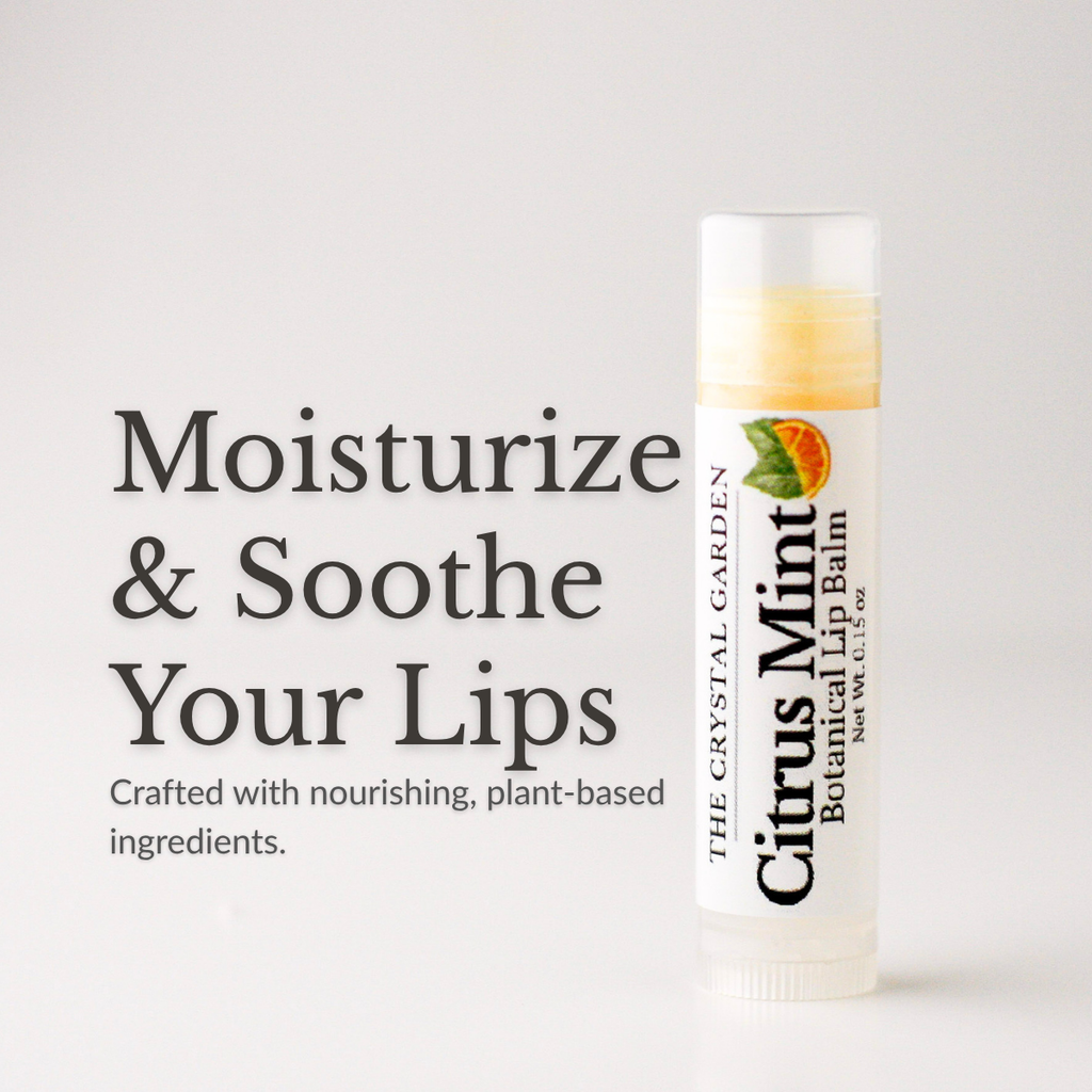 A tube of The Crystal Garden Botanical Lip Balm in Citrus Mint is shown on a light gray background next to promotional text that reads 'Moisturize & Soothe Your Lips'. The lip balm tube is white with a clear cap and features a label with green and orange citrus graphics.