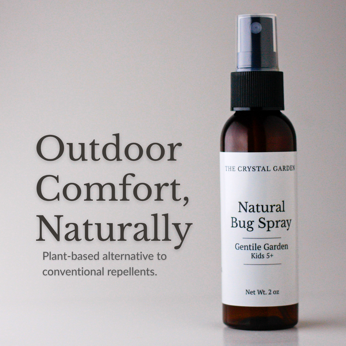 An amber glass spray bottle of The Crystal Garden Natural Bug Spray with a white label, shown next to promotional text on a light gray background.