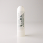 A white cylindrical aromatherapy inhaler tube labeled 'THE CRYSTAL GARDEN Stress Relief Aromatherapy Inhaler' on a light gray background.