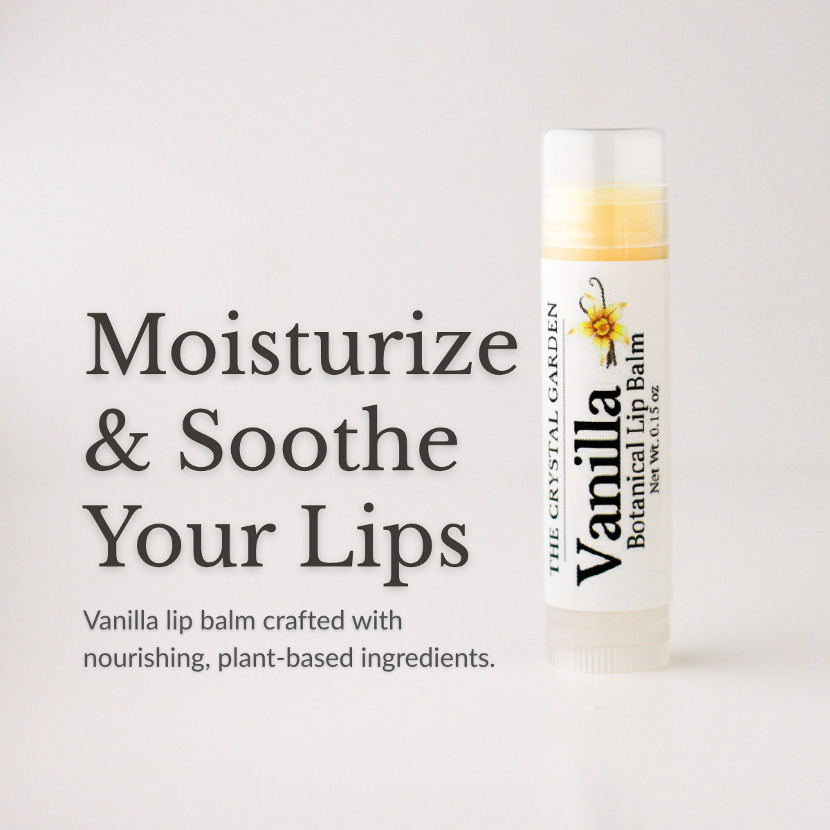 A tube of Vanilla Botanical Lip Balm by The Crystal Garden stands on a light gray background beside large text reading 'Moisturize & Soothe Your Lips' and smaller descriptive copy.