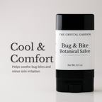 A black and white stick of The Crystal Garden Bug & Bite Botanical Salve stands on a white surface against a light gray background, with text on the left reading 'Cool & Comfort'.