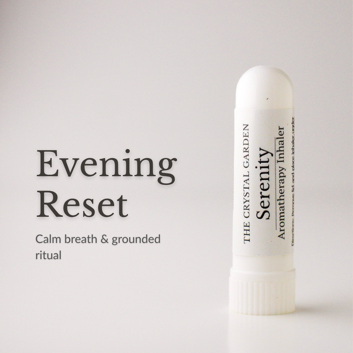 A white cylindrical aromatherapy inhaler tube labeled 'The Crystal Garden Serenity' stands on a light gray background next to text reading 'Evening Reset' and 'Calm breath & grounded ritual'.