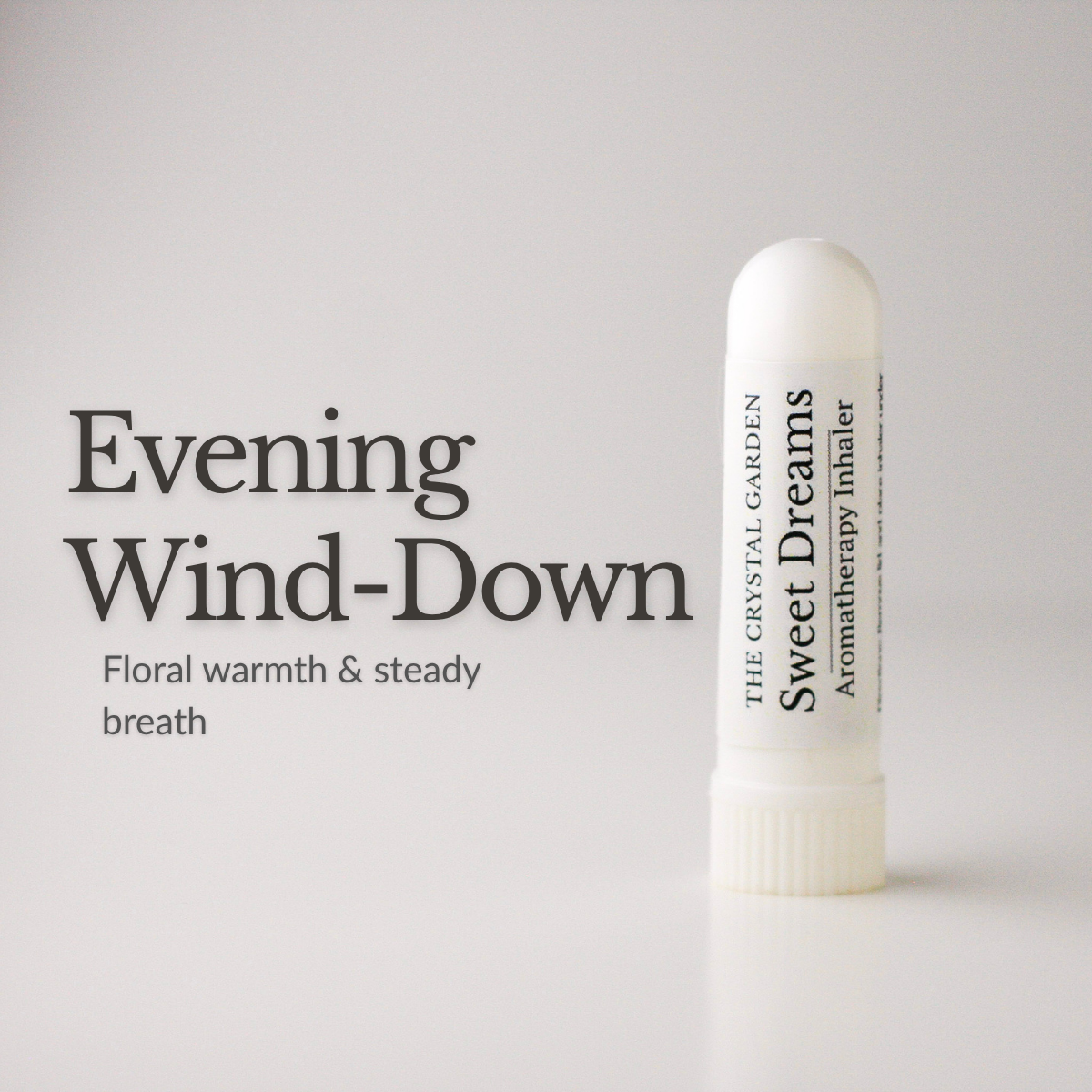 A white cylindrical aromatherapy inhaler bottle labeled 'Sweet Dreams' by The Crystal Garden, shown on a light gray background with the text 'Evening Wind-Down' and 'Floral warmth & steady breath' to the left.