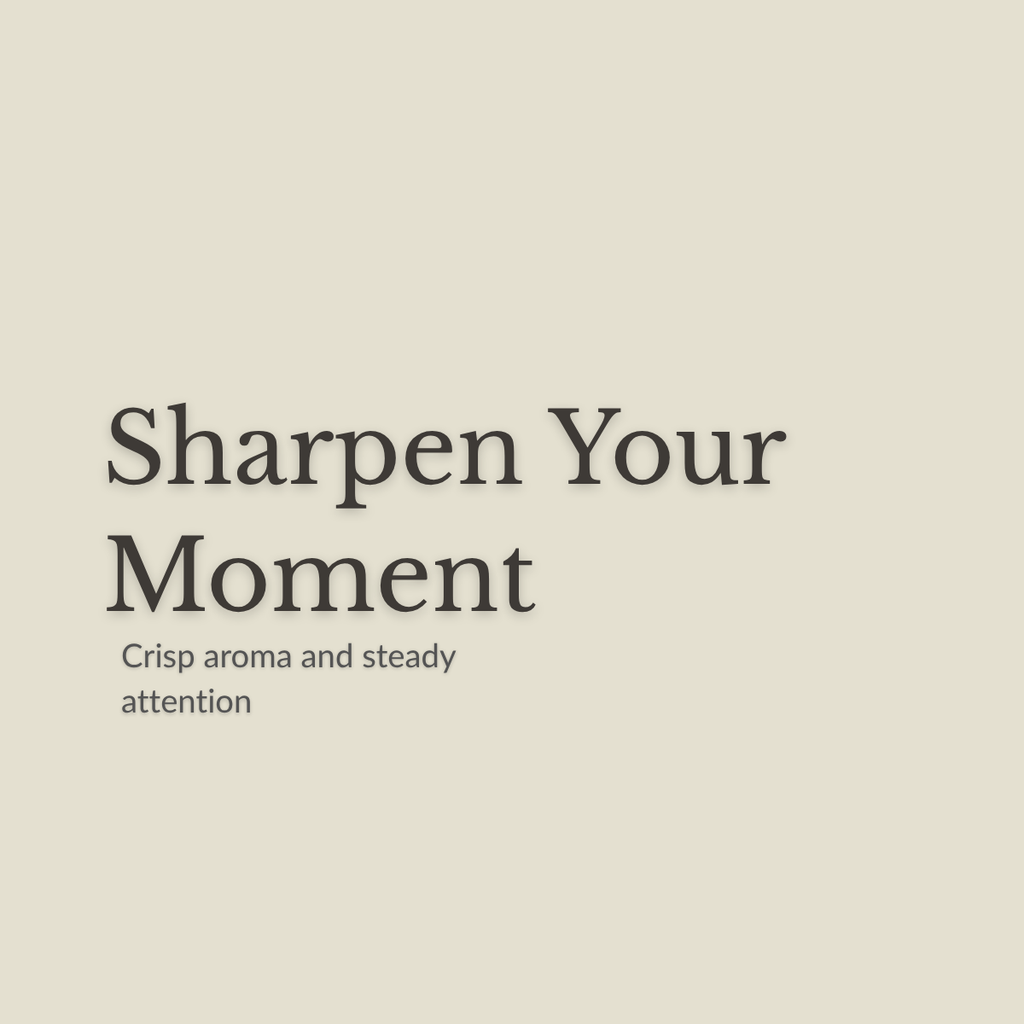 A minimalist square graphic with the phrase 'Sharpen Your Moment' in large dark serif text and the smaller subtitle 'Crisp aroma and steady attention' on a warm light beige background.
