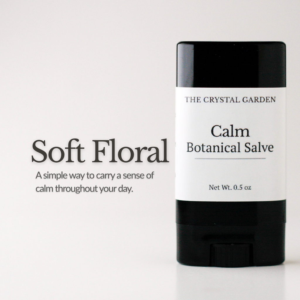 A single stick of botanical salve by The Crystal Garden in the 'Soft Floral' scent, shown on a clean white background with descriptive text on the left.