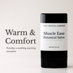 A black and white stick of The Crystal Garden Muscle Ease Botanical Salve stands on a white surface against a white background, with text on the left reading 'Warm & Comfort' and 'Provides a soothing warming sensation.'.