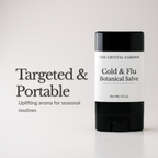 A black and white stick of 'The Crystal Garden' Cold & Flu Botanical Salve stands on a white surface next to promotional text that reads 'Targeted & Portable'.